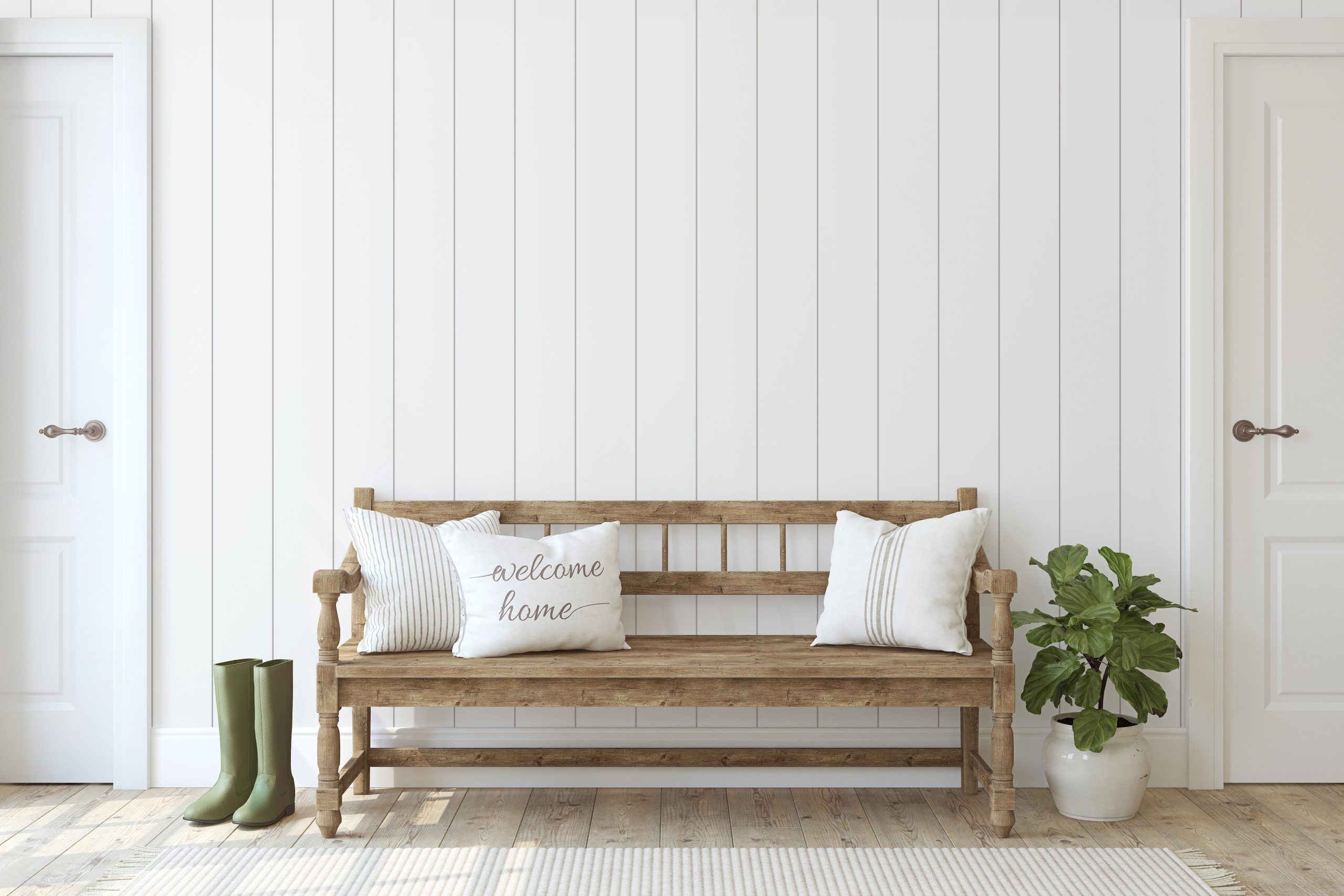 Airbnb Entryway Design by Kenchel Interior Design Welcoming Airbnb entryway with a wooden bench, decorative pillows, a potted plant, and green boots adding charm and functionality to the design.